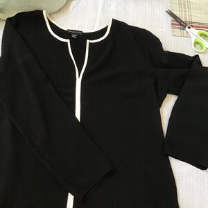Woman’s black long sleeve top